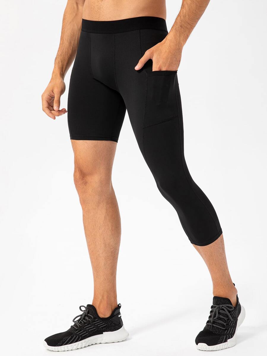 Manfinity Athleisure Calzas ajustadas deportivas para hombre en colores sólidos, con bolsillo para teléfono móvil incorporado. - Negro - Ver 1
