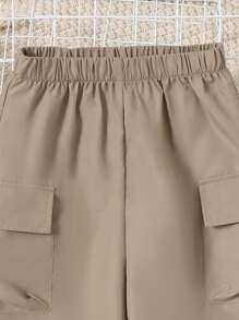 女孩側翻蓋口袋工裝褲