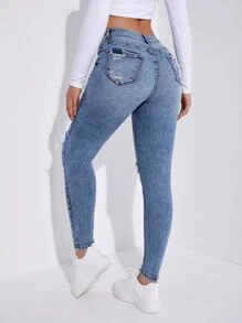 SHEIN Essnce Jeans ajustados desgarro