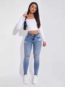 SHEIN Essnce Jeans ajustados desgarro