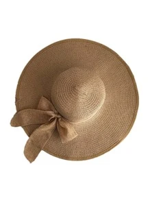 Un sombrero de sol para mujeres con lazo, borde plegable, protección UV y adecuado para playa o moños