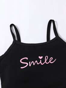 女孩字母圖案吊帶上衣和前蝴蝶結不對稱下擺半身裙