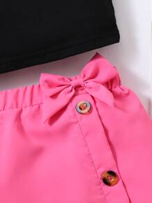 女孩字母圖案吊帶上衣和前蝴蝶結不對稱下擺半身裙