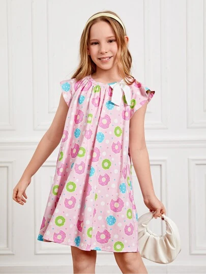 Nency Escamilla 女孩甜甜圈和波點圖案前蝴蝶結連衣裙