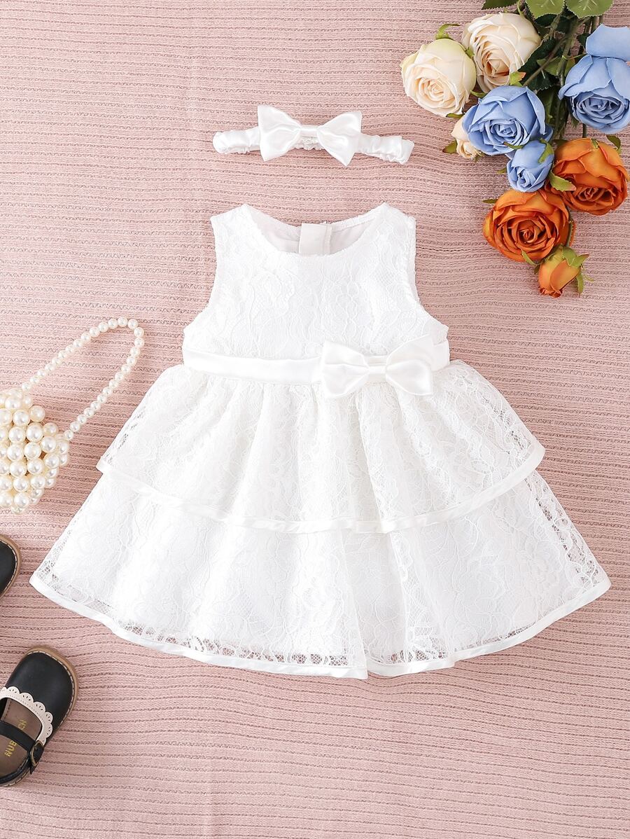 Đầm em bé Tương phản ren phân lớp Nơ trước màu trơn Buổi tiệc - trắng - Xem 1