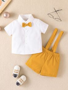 男嬰前蝴蝶結襯衫和背帶短褲