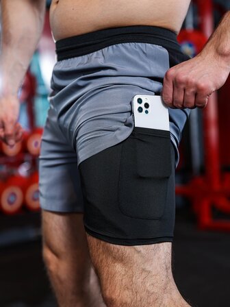 Manfinity Sport Corelite 男士拼色假兩件運動短褲和手機口袋