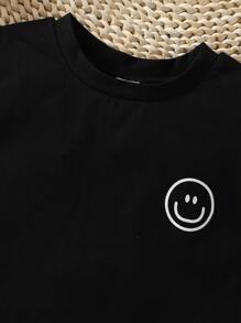 男嬰卡通臉圖案T恤