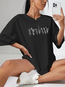 INAWLY Camiseta gráfica holgada con estampado floral y hombros caídos para mujeres