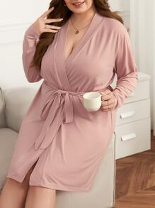 Bata con cinturón unicolor