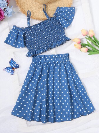 女孩波點圖案挖肩上衣和裙子