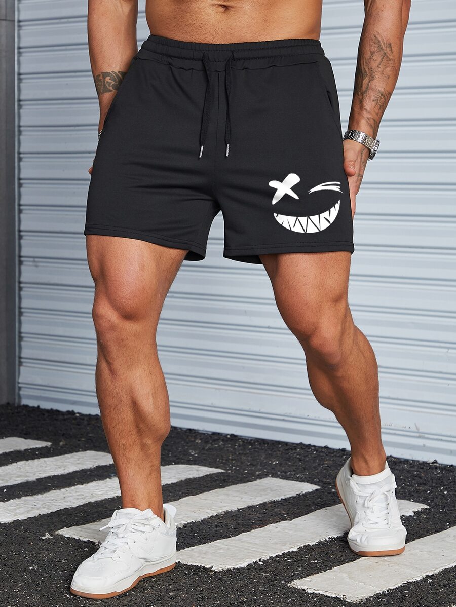 Manfinity Homme Quần short cạp rút họa tiết hoạt hình cho nam, quần short thường ngày đi chơi, quần short có dây rút, dành cho chồng, quà tặng bạn trai, quần short hoạt hình cho nam - màu đen - Xem 1