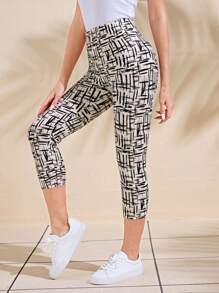 EMERY ROSE Women's Casual High-Waisted Graphic Printed Cropped Leggings Tights Capris - Black and White - View 4