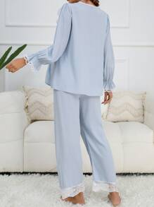 SHEIN Conjunto de pijama de top con volantes en mangas y bajo y pantalones para madre, ropa de otoño e invierno