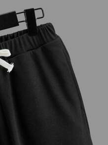 SHEIN garotos figura gráfica Camiseta & cintura com cordão Calças de treino