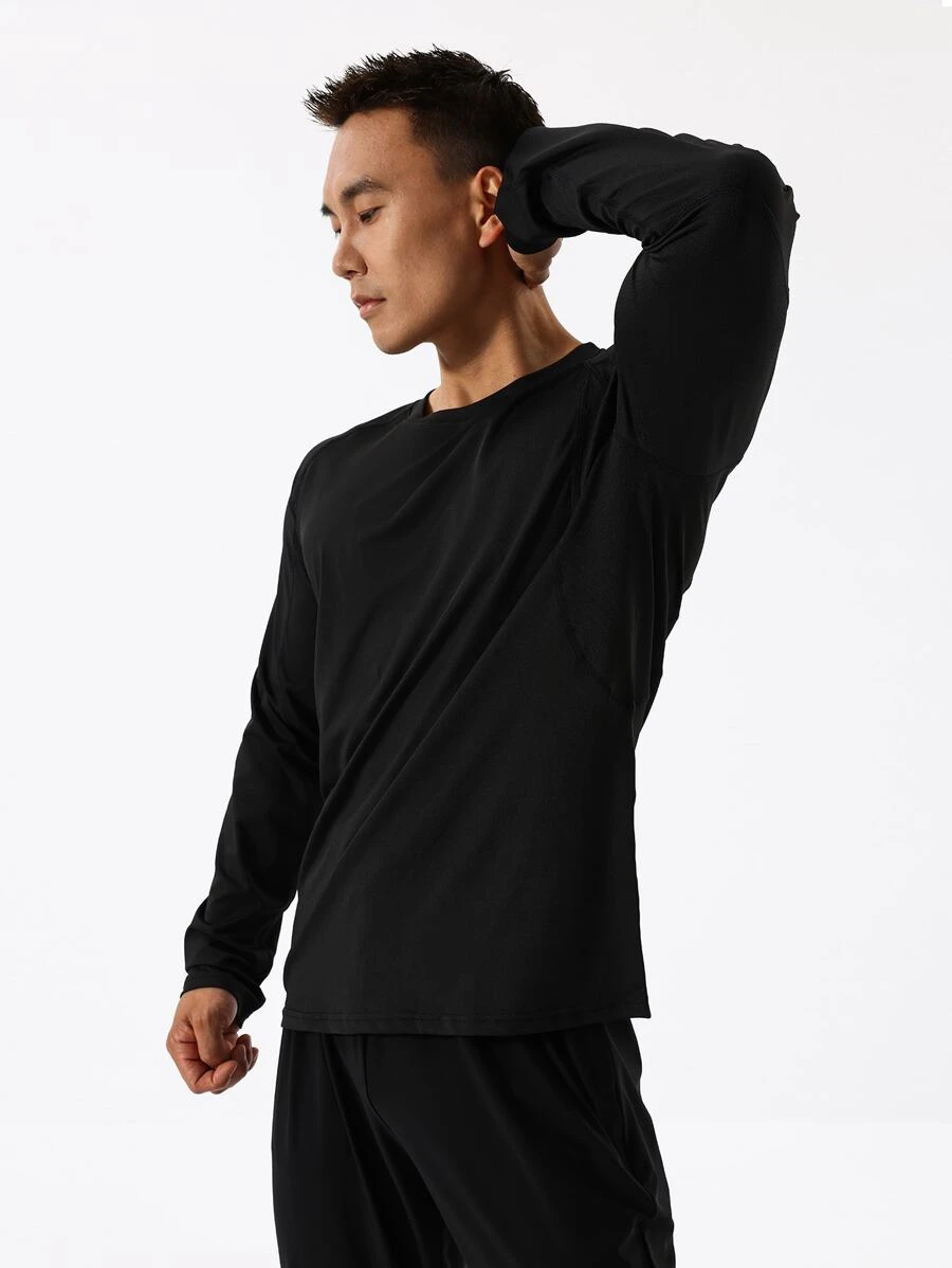 Hombres Camiseta deportiva unicolor de manga raglán - Negro - Ver 1