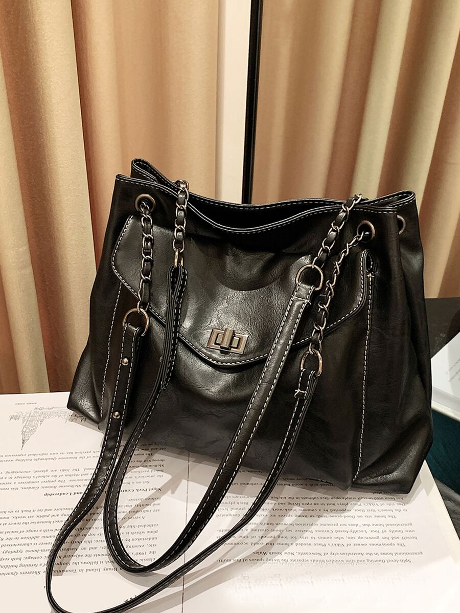 Bolso tote con cerradura girante de hombros con cadena