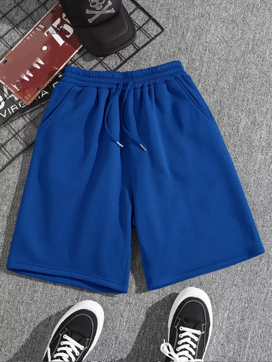 Manfinity Dauomo Pantalones cortos con cintura con cordón y bolsillos en diagonal para hombres - azul real - Ver 1