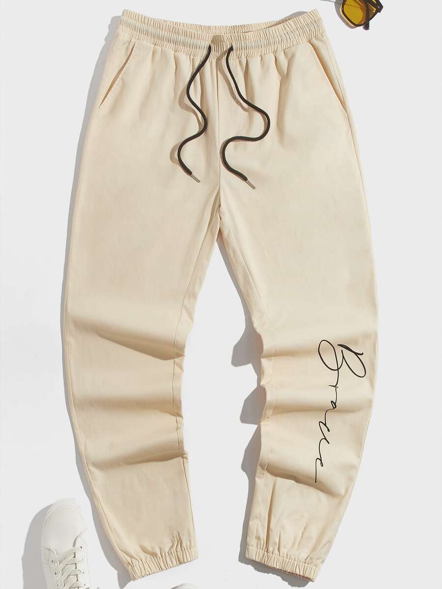 GENTILAND Men Letter Graphic Drawstring Waist Trousers - Beige - View 1