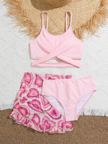 青少年女孩交叉比基尼套装，配有心形印花荷叶边下摆沙滩裙，夏季海滩