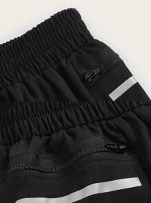 SHEIN Sports Pantalones cortos deportivos con bolsillo con cremallera para teléfono - Negro - Ver 4
