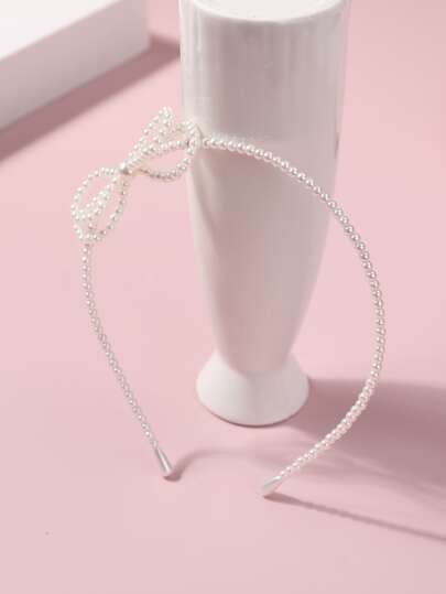 女孩蝴蝶結和人造珍珠裝飾髮箍