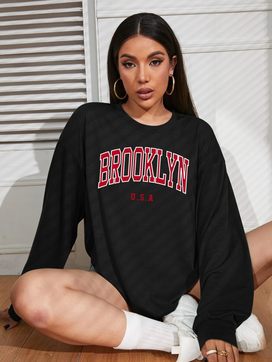 INAWLY Áo thun hở vai họa tiết chữ cái Áo thun họa tiết nữ Áo vải thu cho nữ - màu đen - Xem 1