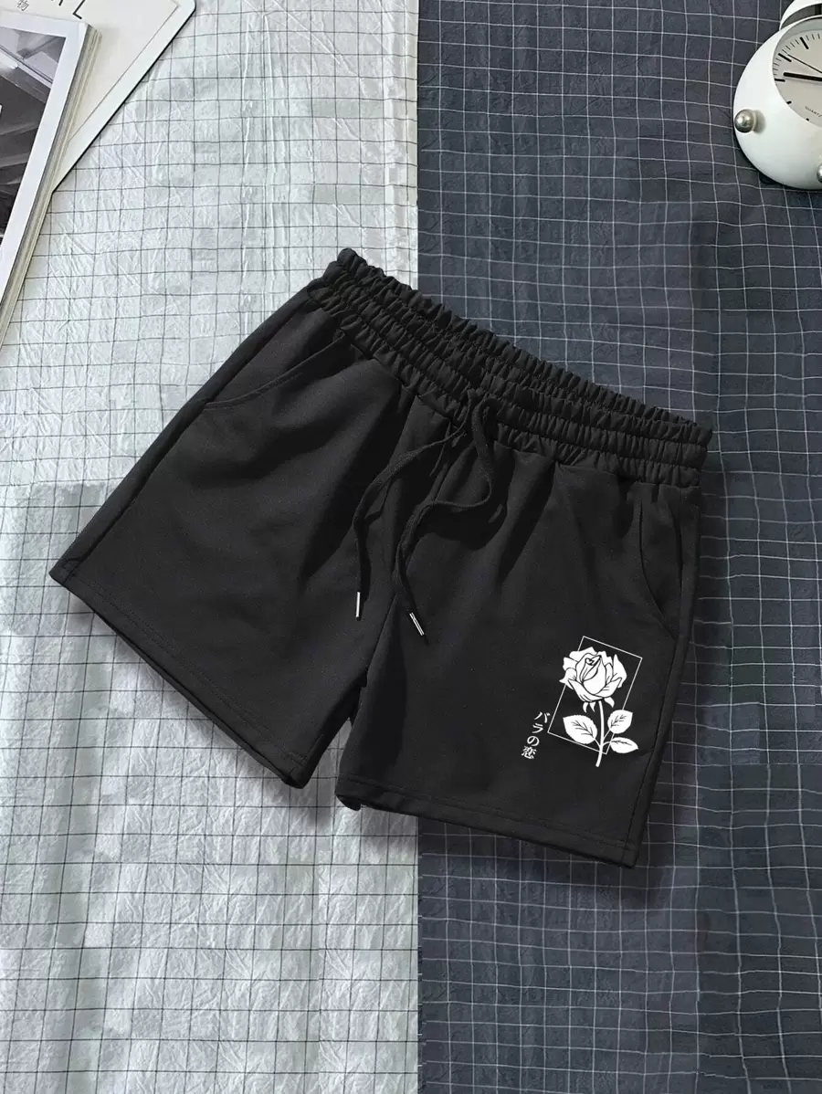 Manfinity Hypemode Pantalones cortos con estampado de rosas y cordón en la cintura para hombres, pantalones cortos con diseño de dibujos animados para hombres - Negro - Ver 1