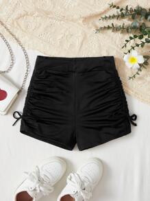 SHEIN Shorts de punto color sólido para niña preadolescente con banda cruzada en la cintura lateral y detalles fruncidos con lazo, ideal para ciclismo