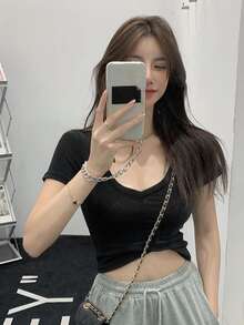 Camiseta crop unicolor - Negro - Ver 1