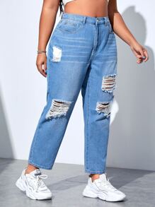 Jeans ajustados mom desgarro de talle alto