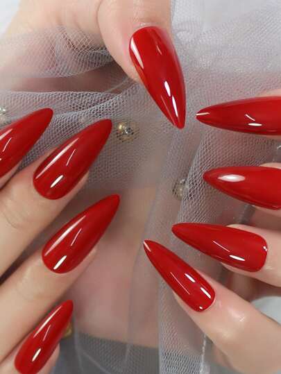 Werten Sie Ihren Look sofort auf mit 24 Stücke langen, glänzenden künstlichen Fingernägeln im Stiletto-Stil in Rot, 1 Blatt Klebeband, 1 Nagelfeile und 1 Stück aufklebbaren Nägeln. Nagelzubehör