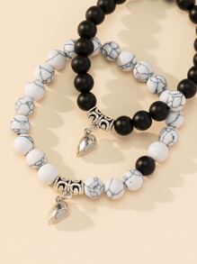 Set de 2 pulseras de hombre con cuentas mate con efecto agrietado y dije magnético de corazón, como regalo de San Valentín