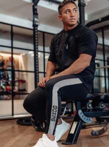 Manfinity Fitness 男士字母圖案拼接側邊接縫運動褲