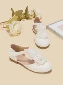 女孩花朵裝飾T字帶時尚白色平底鞋