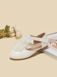 女孩花朵裝飾T字帶時尚白色平底鞋