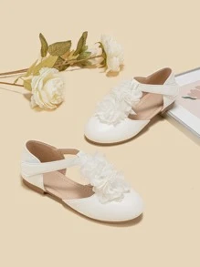 女孩花朵裝飾T字帶時尚白色平底鞋