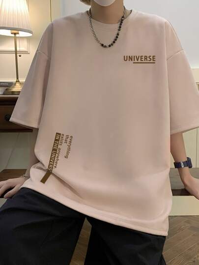 Tee-shirt ample à épaules tombantes pour hommes avec slogan graphique