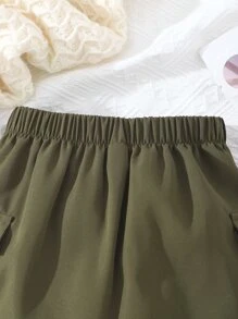 女孩翻蓋口袋帶扣細節工裝裙