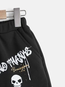 SHEIN 男孩卡通和字母圖案短褲