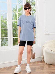 SHEIN Solid Color Loose Round Neck Teen Girls' Letter Print Dropped Shoulder T-Shirt