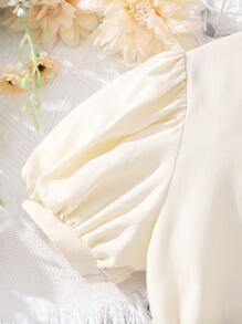 少女泡泡袖高低不規則襯衫