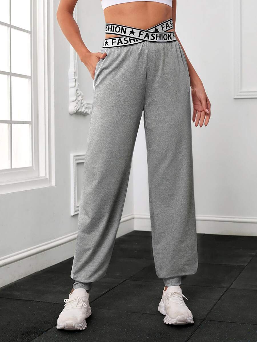 交叉腰部字母條帶斜口袋運動褲