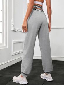 交叉腰部字母條帶斜口袋運動褲