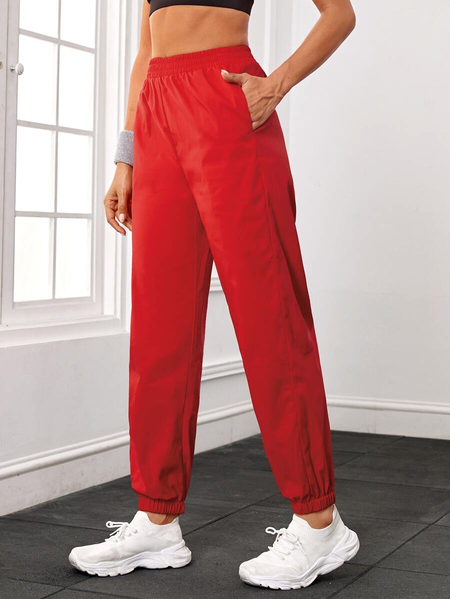 Pantalones deportivos unicolor con bolsillo oblicuo - Rojo - Ver 1