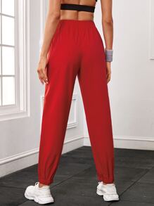 Pantalones deportivos unicolor con bolsillo oblicuo - Rojo - Ver 2