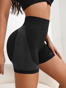 SHEIN Sport Studio Pantalones cortos deportivos para mujer de cintura ancha, con estirada sin costuras y efecto levantador de glúteos