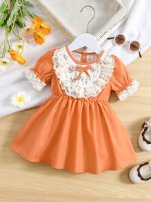 Đầm em bé Tương phản ren Nơ trước Khối Màu Họa tiết hoa - trái cam - Xem 1
