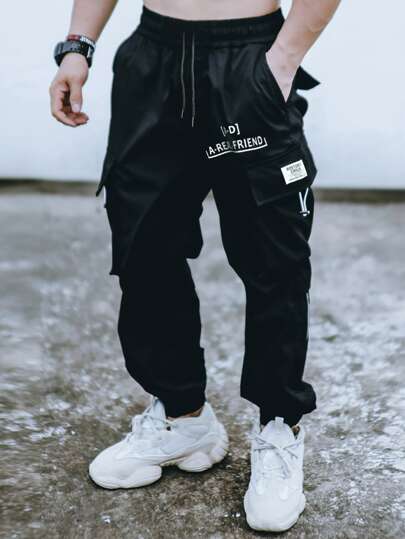 Manfinity Roghcode 男士寬鬆貨物褲,帶有字母圖形翻蓋口袋和束口腰帶