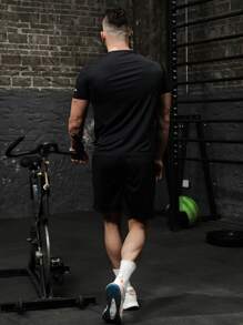 Manfinity Sport Corelite Conjunto deportivo con gráfico de lema para hombre, traje atlético, conjunto de chándal para entrenamiento, top transpirable para gimnasio - Negro - Ver 2